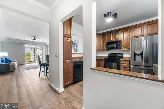 8609 Wintergreen Ct Unit 308, Odenton, MD 21113 - kitchen featuring black appliances, ceiling fan, light wood-style floors, crown molding, and baseboards
