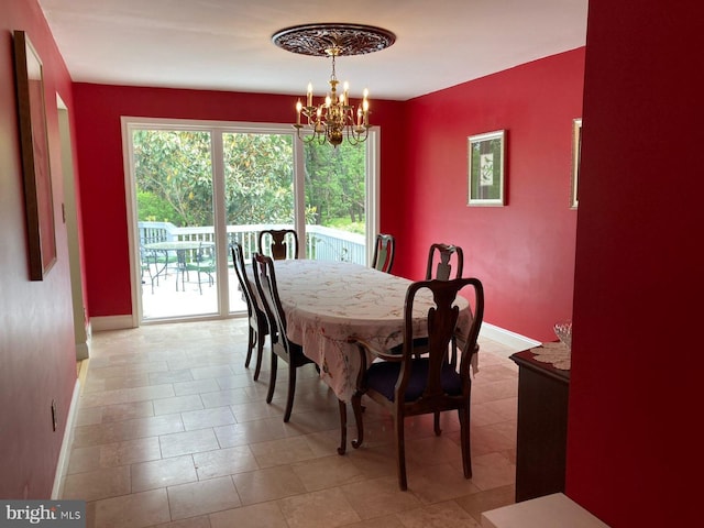 5 Garfield Ct, Gaithersburg, MD 20882 - dining area featuring a chandelier and baseboards