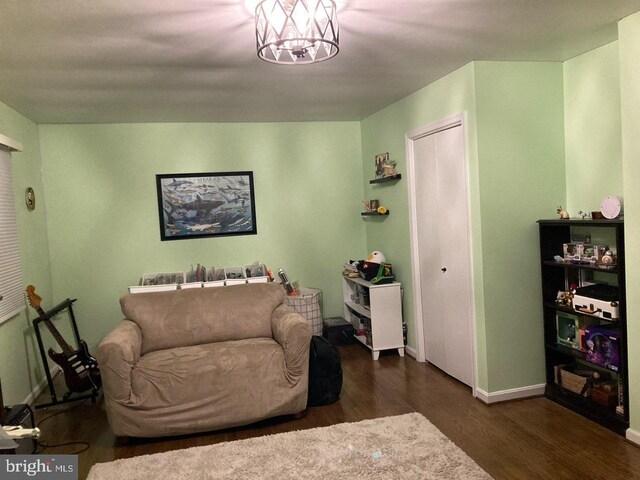 5 Garfield Ct, Gaithersburg, MD 20882 - living area featuring dark wood finished floors, baseboards, and a chandelier