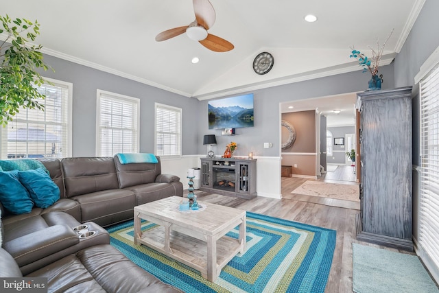 806 209th St, Pasadena, MD 21122 - living room with ceiling fan, vaulted ceiling, light wood-style floors, a fireplace, and crown molding