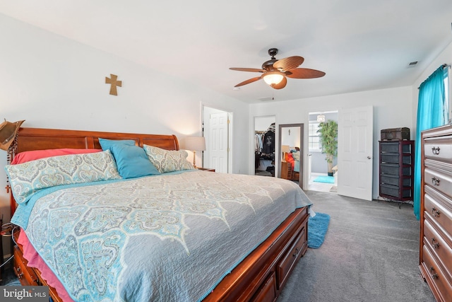 806 209th St, Pasadena, MD 21122 - bedroom featuring dark carpet, a walk in closet, a closet, and a ceiling fan