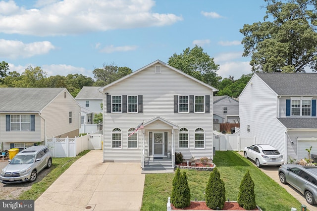 806 209th St, Pasadena, MD 21122 - traditional-style home featuring a gate, a residential view, and concrete driveway