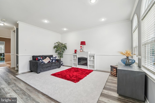 806 209th St, Pasadena, MD 21122 - living area featuring ornamental molding, plenty of natural light, wood finished floors, recessed lighting, and baseboards