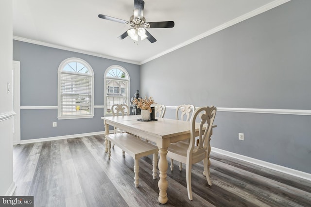 806 209th St, Pasadena, MD 21122 - dining area with ceiling fan, wood finished floors, crown molding, and baseboards