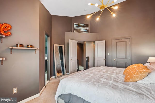 12205 Desoto Falls Ct, Bristow, VA 20136 - carpeted bedroom featuring a towering ceiling, a chandelier, and baseboards