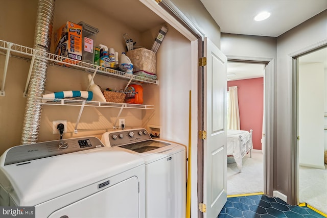 12205 Desoto Falls Ct, Bristow, VA 20136 - laundry room featuring washing machine and dryer and dark carpet