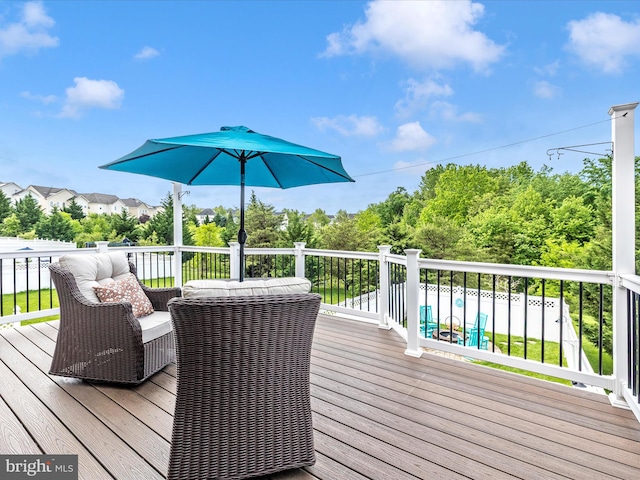 deck featuring a swimming pool
