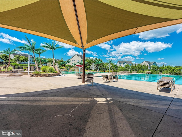community pool with a patio
