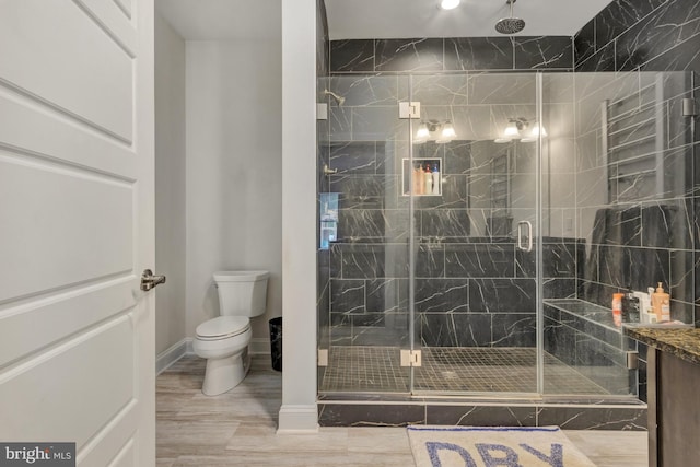 40 Doc Ct, Felton, DE 19943 - bathroom featuring toilet, a marble finish shower, baseboards, and wood finished floors