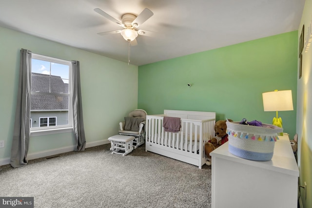 40 Doc Ct, Felton, DE 19943 - bedroom featuring carpet, a nursery area, a ceiling fan, and baseboards