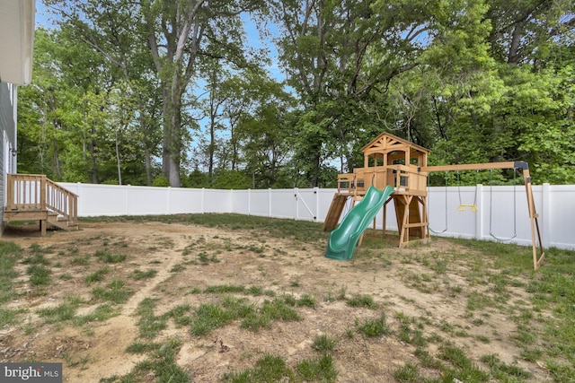 40 Doc Ct, Felton, DE 19943 - view of play area with a fenced backyard and view of wooded area