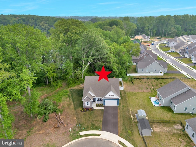 40 Doc Ct, Felton, DE 19943 - aerial view of property and surrounding area featuring a heavily wooded area and nearby suburban area