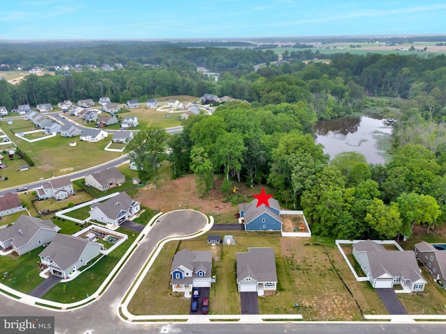 40 Doc Ct, Felton, DE 19943 - aerial view of property and surrounding area featuring nearby suburban area, a nearby body of water, and a forest