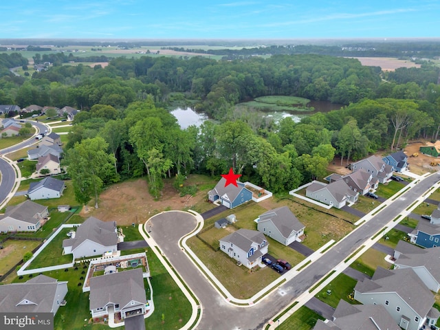 40 Doc Ct, Felton, DE 19943 - aerial view of property and surrounding area with nearby suburban area, a nearby body of water, and a heavily wooded area