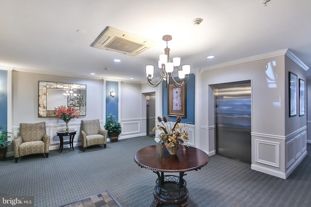 common area featuring ornamental molding, recessed lighting, and a decorative wall