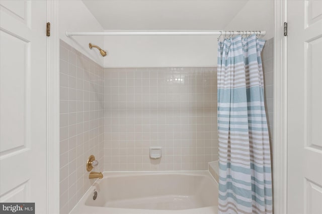 bathroom with shower / bathtub combination with curtain