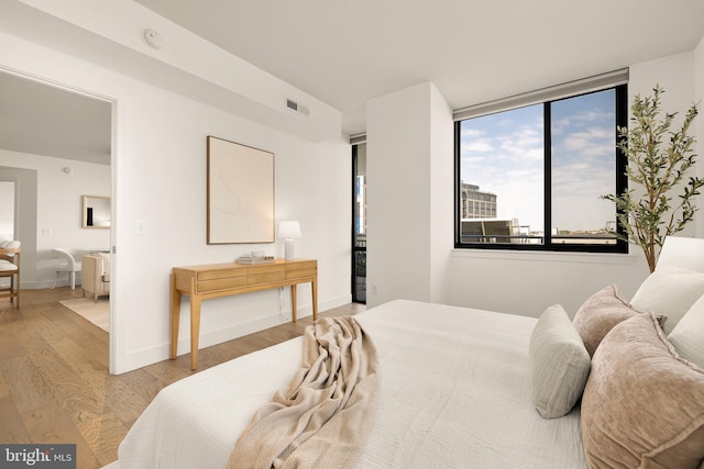 50 Florida Ave NE Unit 802, Washington, DC 20002 - bedroom with wood finished floors and baseboards
