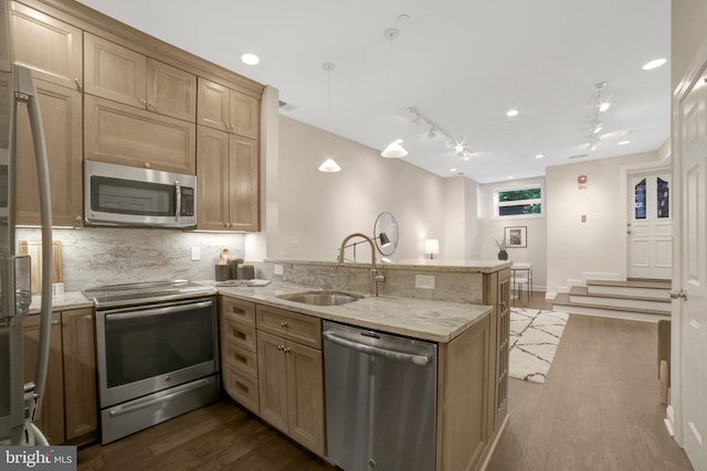 1332 Park Rd NW Unit A, Washington, DC 20010 - kitchen featuring stainless steel appliances, a peninsula, a sink, dark wood-style flooring, and backsplash