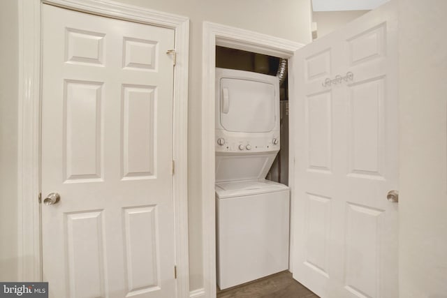 1332 Park Rd NW Unit A, Washington, DC 20010 - laundry area with stacked washer / dryer and dark wood-style floors