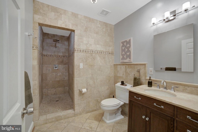 1332 Park Rd NW Unit A, Washington, DC 20010 - bathroom featuring tile walls, tile patterned flooring, toilet, a walk in shower, and vanity