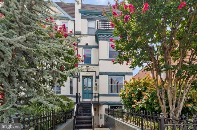 1332 Park Rd NW Unit A, Washington, DC 20010 - view of front of property featuring brick siding and fence
