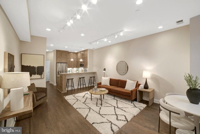 1332 Park Rd NW Unit A, Washington, DC 20010 - living room featuring rail lighting, baseboards, and wood finished floors