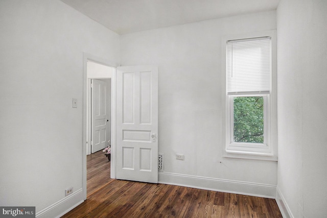 4558 Unruh Ave, Philadelphia, PA 19135 - unfurnished room with baseboards and dark wood-style floors