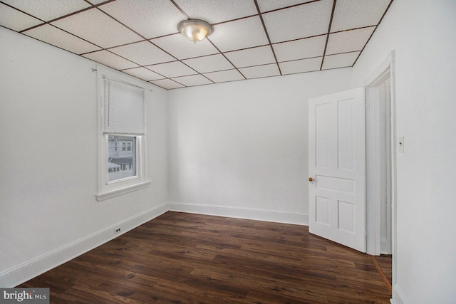 4558 Unruh Ave, Philadelphia, PA 19135 - unfurnished room with a paneled ceiling, dark wood finished floors, and baseboards