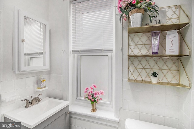 4558 Unruh Ave, Philadelphia, PA 19135 - bathroom featuring tile walls, vanity, and toilet