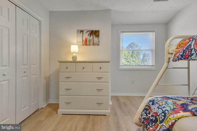 38072 Mockingbird Ln Unit 59, Selbyville, DE 19975 - bedroom featuring light wood-style flooring, baseboards, and a closet