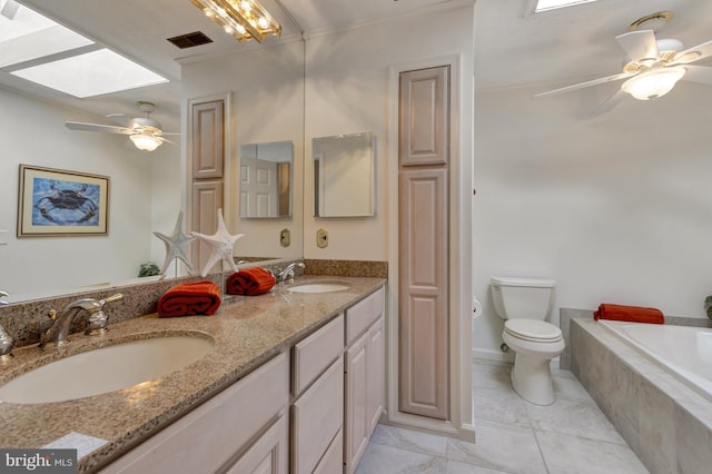 38072 Mockingbird Ln Unit 59, Selbyville, DE 19975 - bathroom with double vanity, a skylight, tiled bath, and toilet