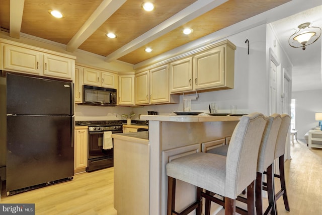 38072 Mockingbird Ln Unit 59, Selbyville, DE 19975 - kitchen featuring black appliances, beam ceiling, light wood finished floors, a breakfast bar area, and a peninsula