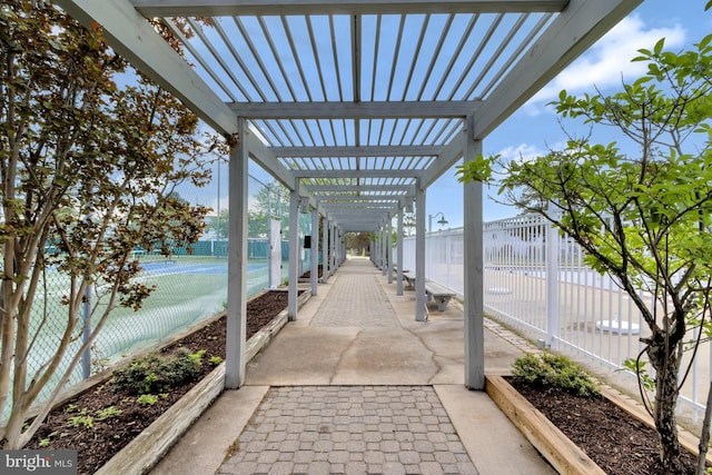 38072 Mockingbird Ln Unit 59, Selbyville, DE 19975 - view of patio featuring a pergola and a tennis court