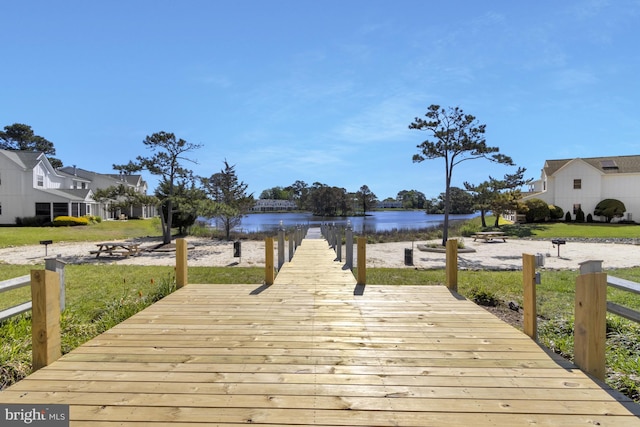 38072 Mockingbird Ln Unit 59, Selbyville, DE 19975 - dock area featuring a water view and a yard