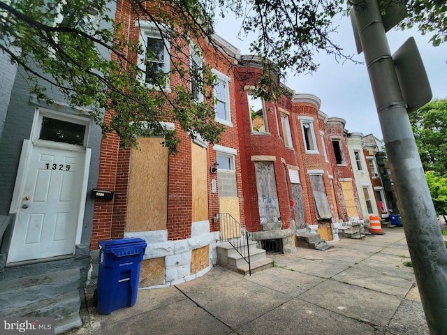 view of building exterior with entry steps