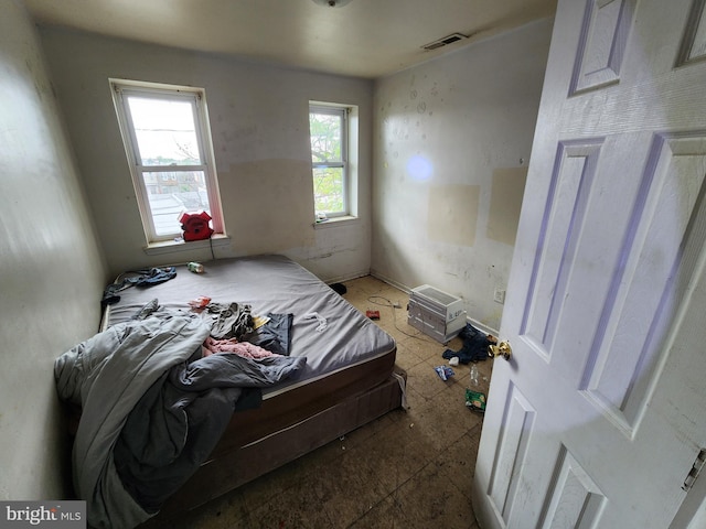 bedroom featuring visible vents