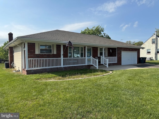 ranch-style home featuring an attached garage, concrete driveway, a front yard, a porch, and brick siding