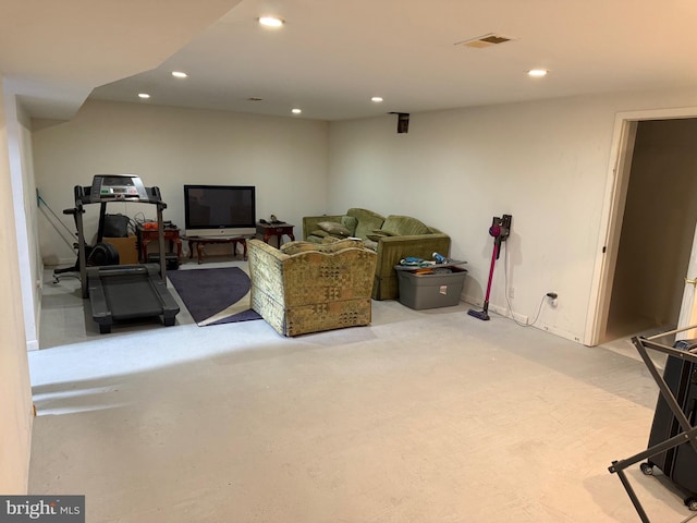 living area with visible vents and recessed lighting