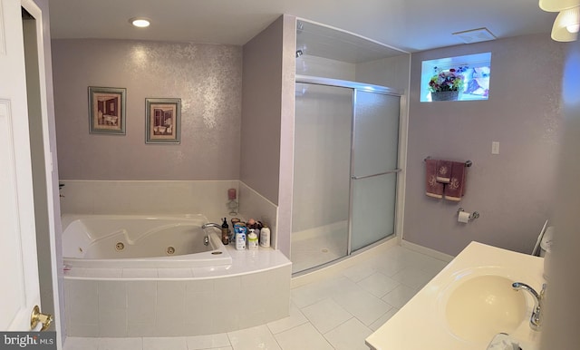 full bath with recessed lighting, a shower stall, tile patterned flooring, a jetted tub, and vanity