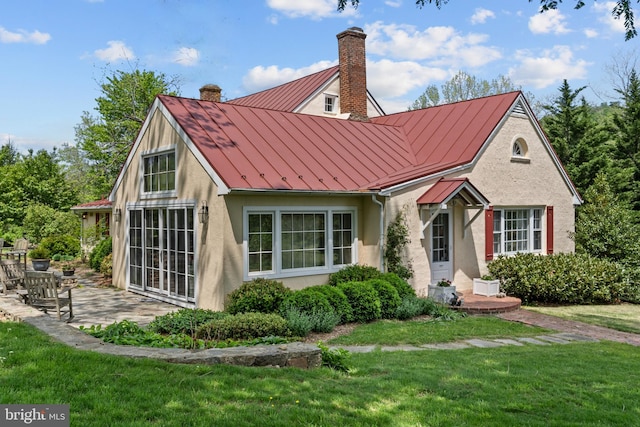 509 Ben Venue Rd, Flint Hill, VA 22627 - view of front facade featuring a standing seam roof, a chimney, stucco siding, metal roof, and a front yard