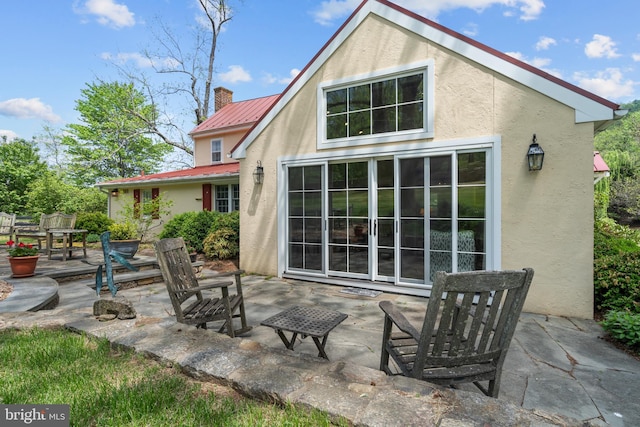 509 Ben Venue Rd, Flint Hill, VA 22627 - back of house featuring stucco siding, a patio area, metal roof, and a chimney