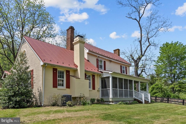 509 Ben Venue Rd, Flint Hill, VA 22627 - back of house featuring a sunroom, a chimney, stucco siding, central AC unit, and metal roof