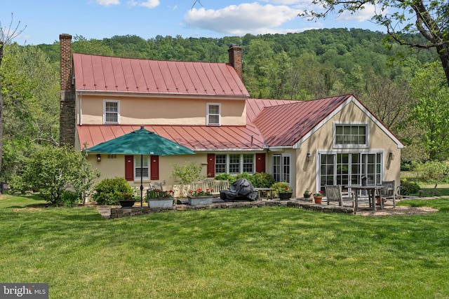 509 Ben Venue Rd, Flint Hill, VA 22627 - back of house featuring a standing seam roof, stucco siding, and a chimney