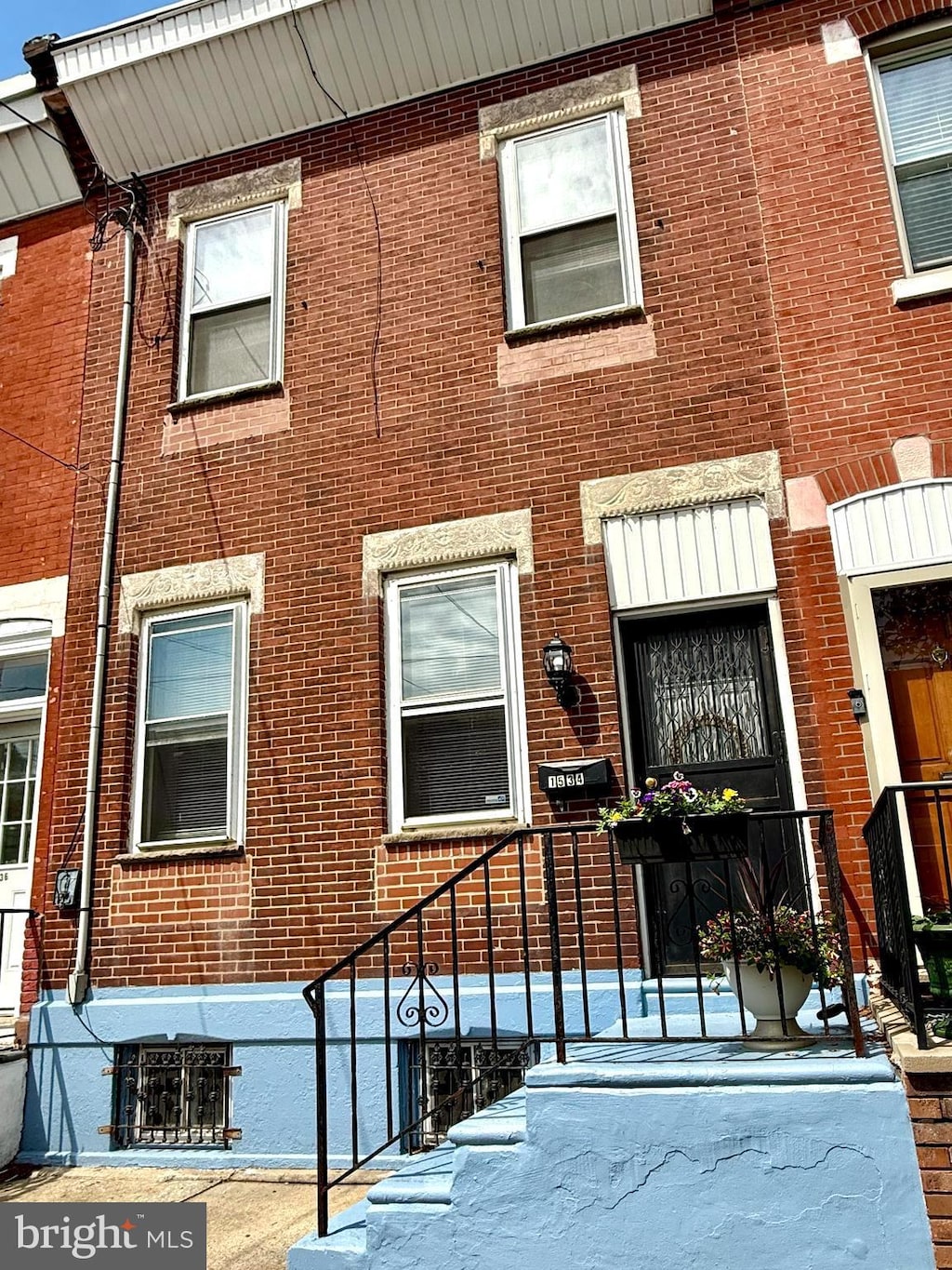 property entrance featuring brick siding