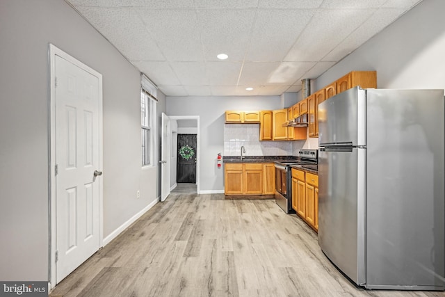 1534 S 19th St, Philadelphia, PA 19146 - kitchen featuring stainless steel appliances, a paneled ceiling, under cabinet range hood, a sink, and light wood-type flooring