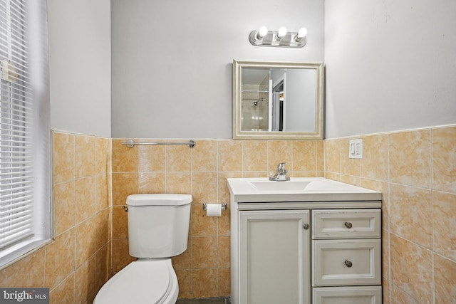 1534 S 19th St, Philadelphia, PA 19146 - bathroom featuring tile walls, toilet, vanity, and wainscoting
