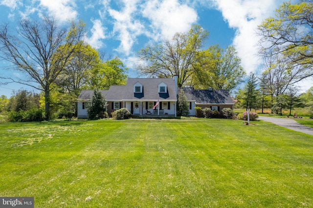 71 Harlingen Rd, Belle Mead, NJ 08502 - cape cod home with a front yard and covered porch