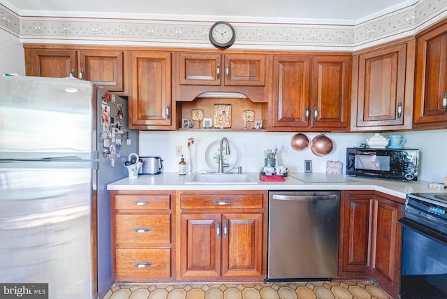71 Harlingen Rd, Belle Mead, NJ 08502 - kitchen with brown cabinetry, black appliances, light countertops, and a sink