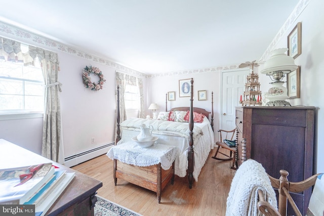 71 Harlingen Rd, Belle Mead, NJ 08502 - bedroom featuring light wood-style flooring and baseboard heating