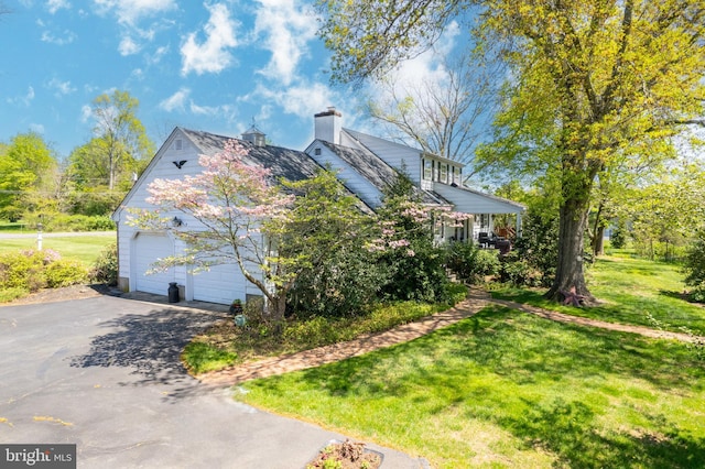 71 Harlingen Rd, Belle Mead, NJ 08502 - view of property exterior featuring a chimney, driveway, a garage, and a lawn